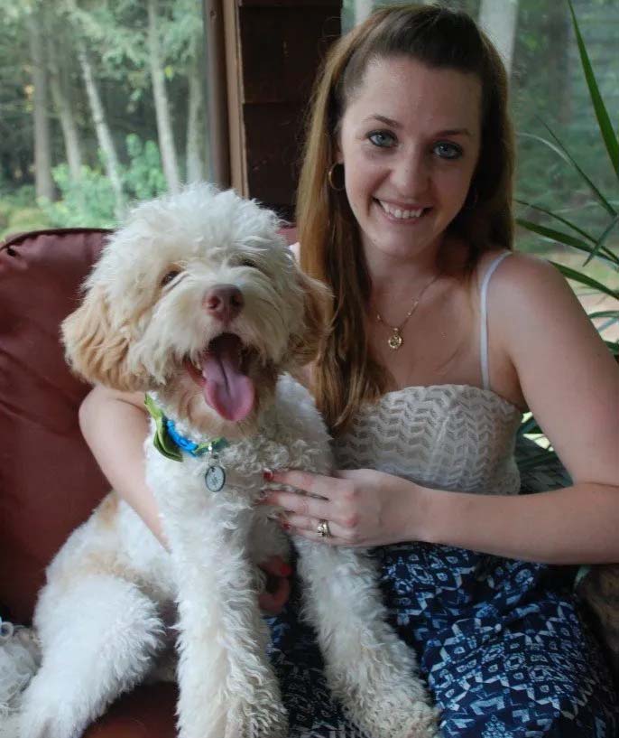 Woman with Labradoodle puppies in NH
